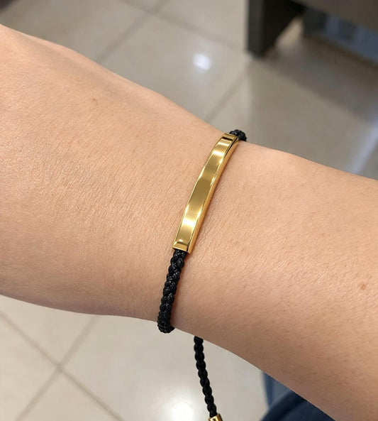 Pulserita cuerda negra metal color dorado
